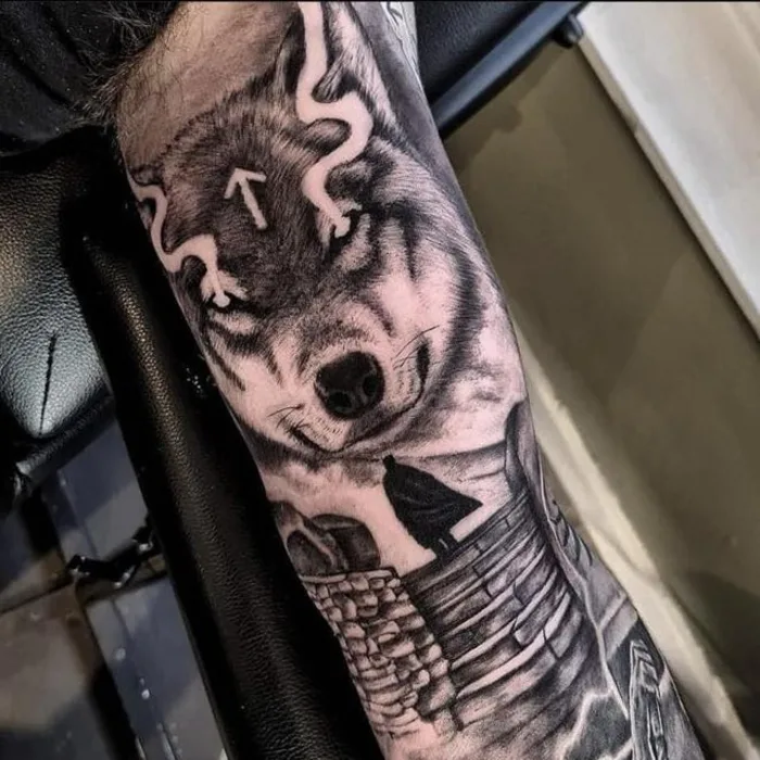 Black and grey wolf forearm piece with heavy realistic shading