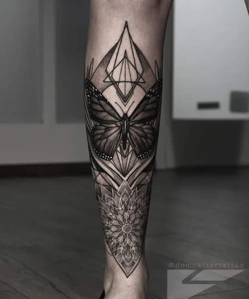 Blackwork geometric and dotwork leg piece by Kai Nakamura